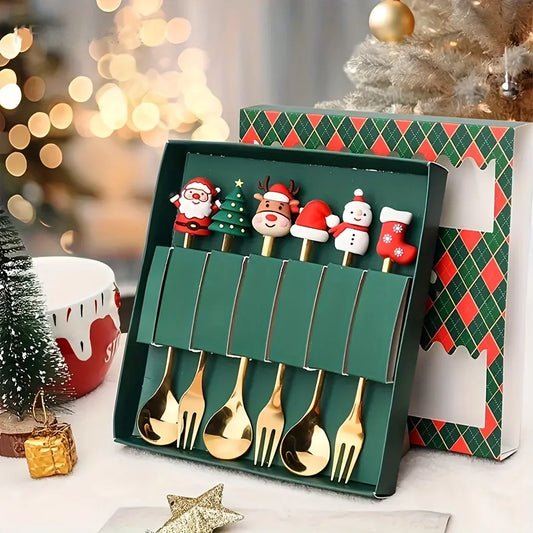 Set of gold Christmas-themed spoons in a decorative box with festive background